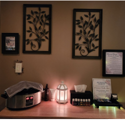Warm massage room with hot stones and aromatherapy